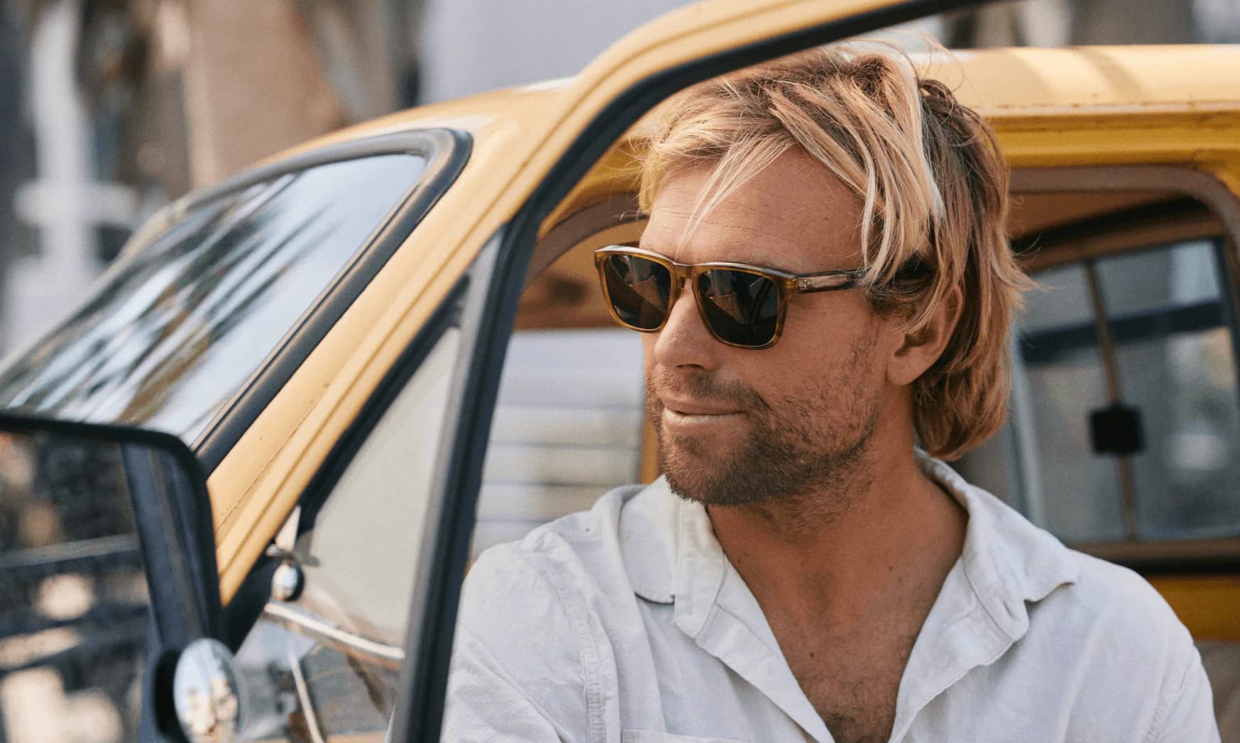 Stylish man wearing premium sunglasses — curated eyewear at Blinc Eyecare